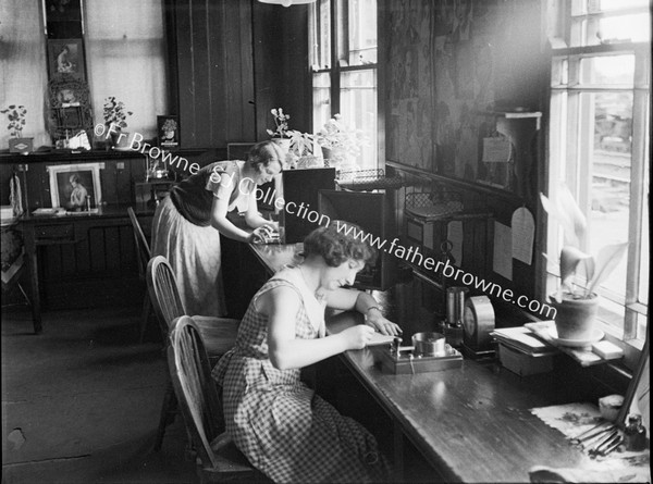 LADIES AT WORK SEWING MACHINES